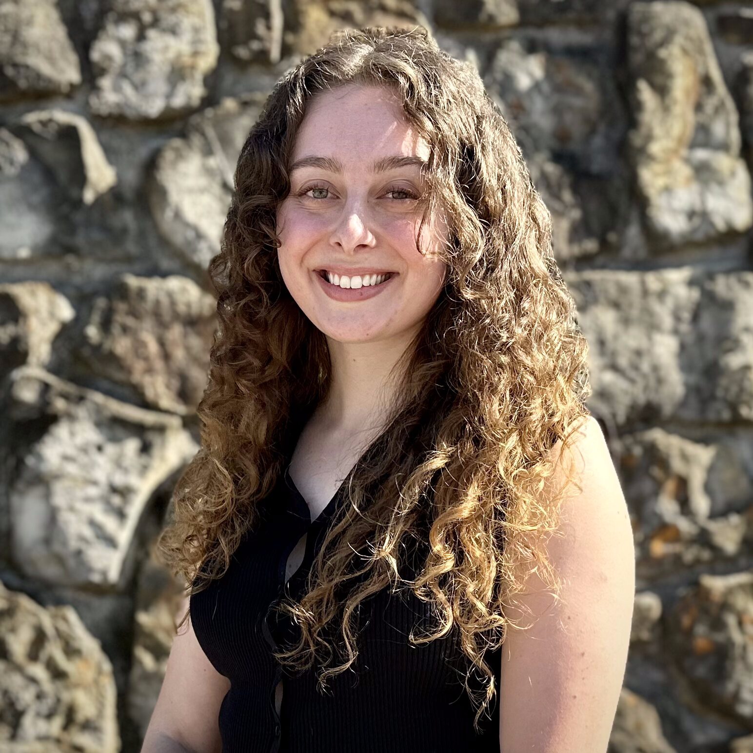 Kate Hilton smiling in a professional portrait, known for her work in couples' communication, trauma therapy and anxiety therapy in Dallas.