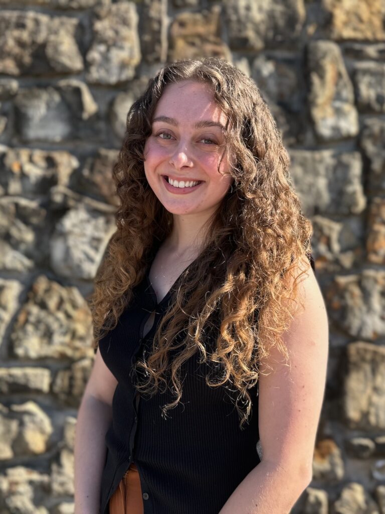 IMG_8160 Kate Hilton smiling in a professional portrait, known for her work in couples' communication and anxiety therapy in Dallas.